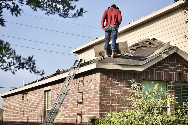 Professional roofer working on a residential roof in Slickport